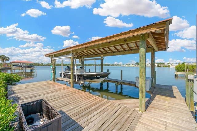 dock featuring boat lift and a water view