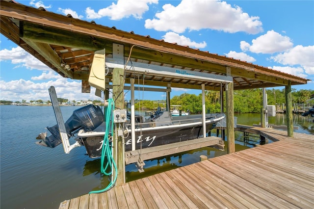 dock featuring boat lift and a water view