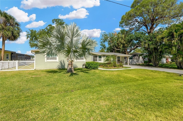 view of front of property with stucco siding and driveway