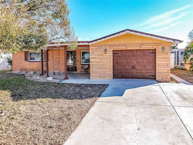 ranch-style home with a garage