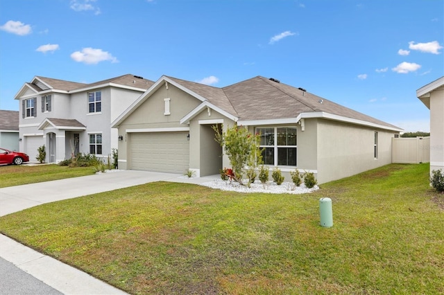 view of front of home featuring a garage and a front yard