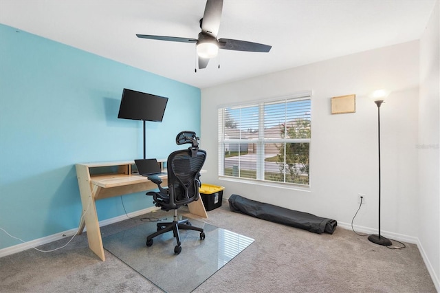 carpeted office featuring ceiling fan