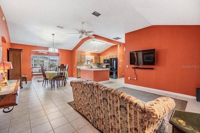 tiled living room with ceiling fan and lofted ceiling