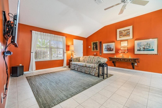 tiled living room with vaulted ceiling and ceiling fan