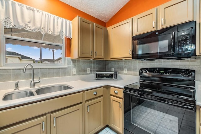 kitchen with sink, light tile patterned floors, tasteful backsplash, black appliances, and vaulted ceiling