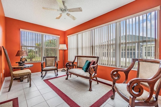 sunroom featuring ceiling fan