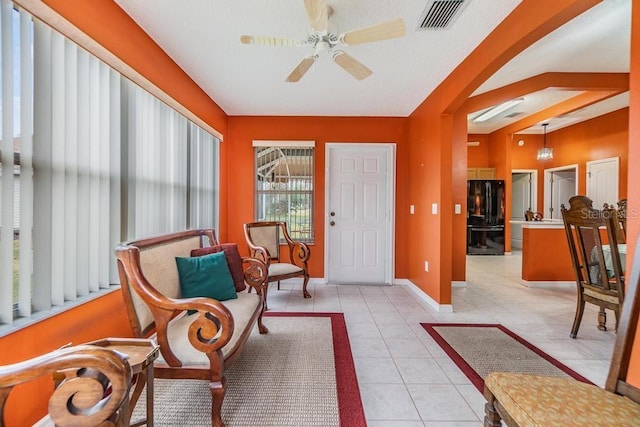 sunroom / solarium with ceiling fan