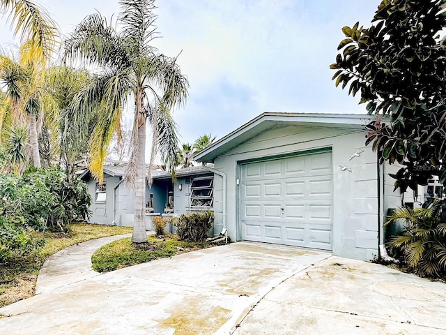 ranch-style house featuring a garage