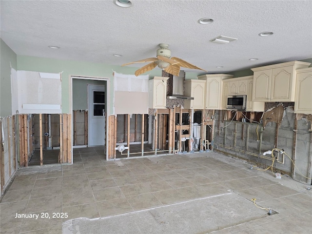 interior space featuring ceiling fan