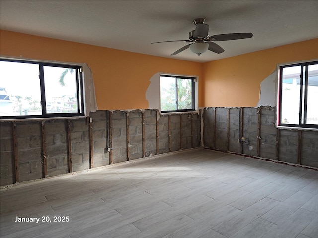 spare room featuring ceiling fan and light hardwood / wood-style floors