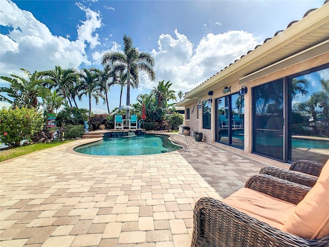 view of swimming pool with a patio