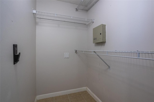 spacious closet featuring light tile patterned floors