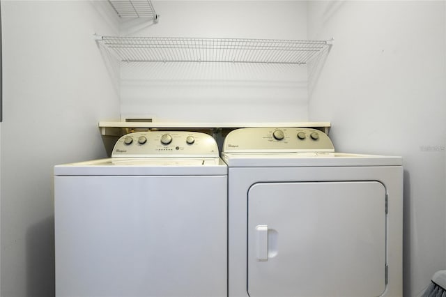 laundry area featuring washing machine and clothes dryer