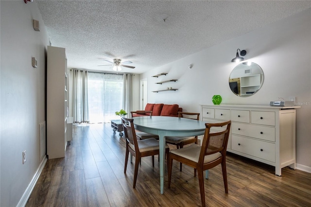 dining room featuring a textured ceiling, dark hardwood / wood-style floors, and ceiling fan