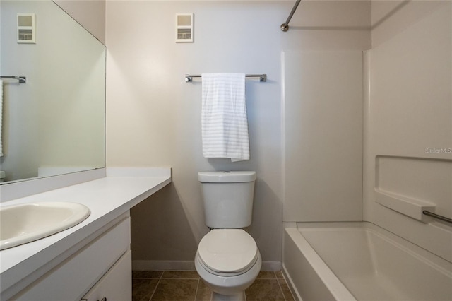 full bathroom with washtub / shower combination, vanity, toilet, and tile patterned flooring