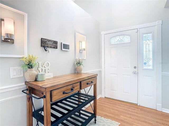 foyer entrance with light wood-type flooring