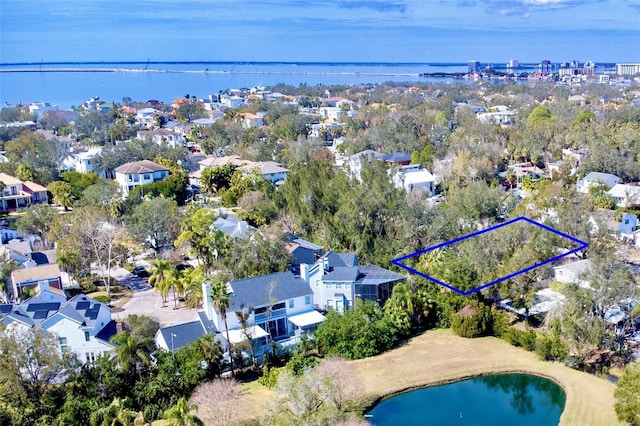 drone / aerial view with a water view