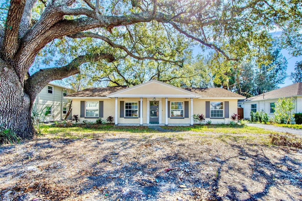 ranch-style home featuring covered porch