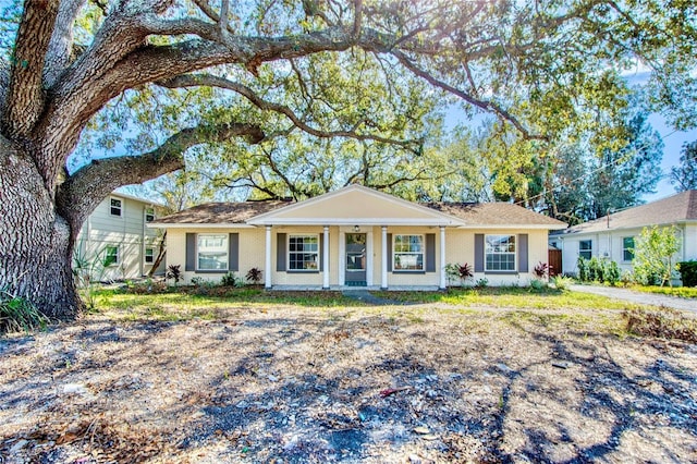 ranch-style home featuring covered porch