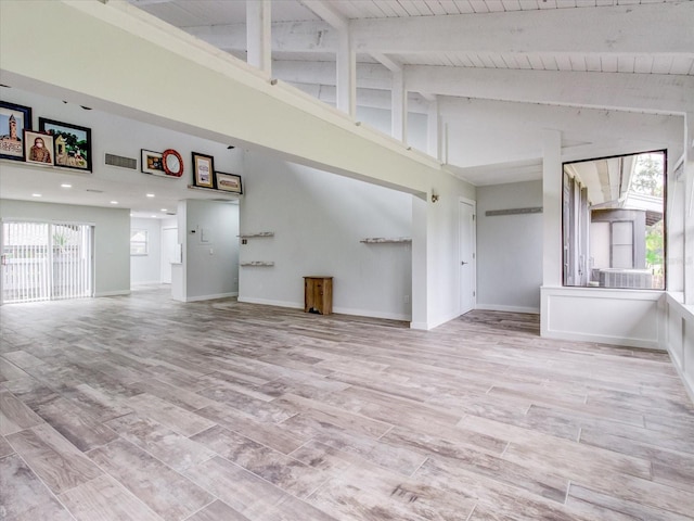 unfurnished living room with high vaulted ceiling, beam ceiling, and wooden ceiling