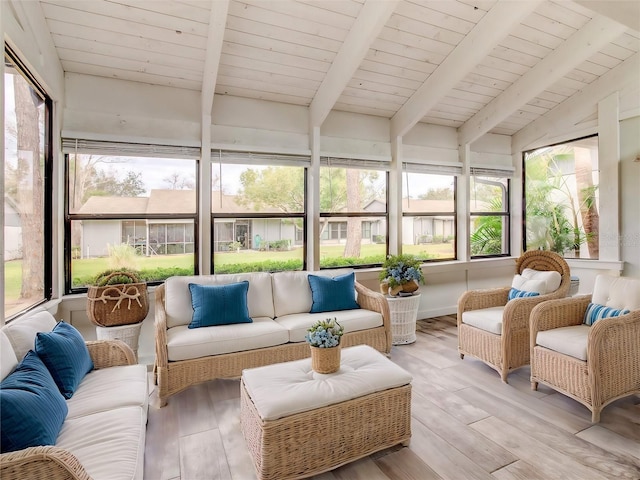 sunroom / solarium featuring wood ceiling, plenty of natural light, and lofted ceiling with beams