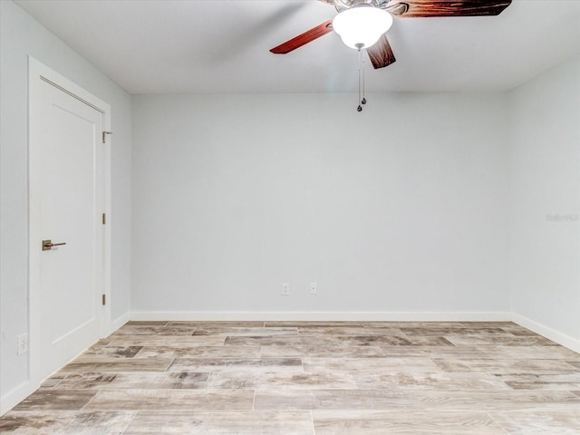 spare room with light hardwood / wood-style flooring and ceiling fan