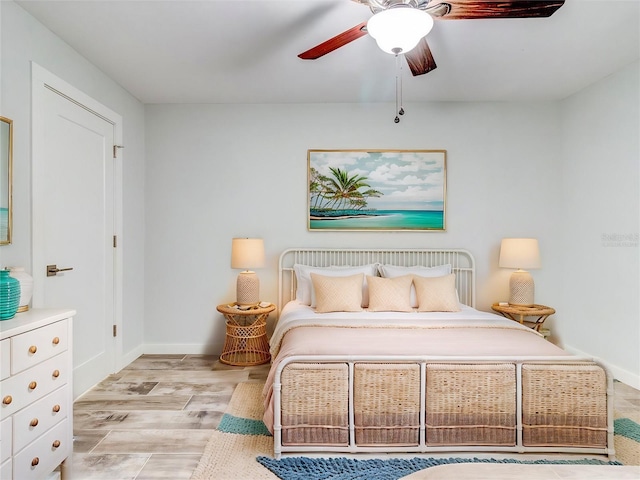 bedroom featuring light hardwood / wood-style floors and ceiling fan