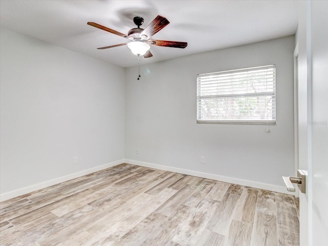 empty room with ceiling fan and light wood-type flooring