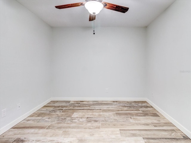 empty room featuring ceiling fan and light hardwood / wood-style flooring