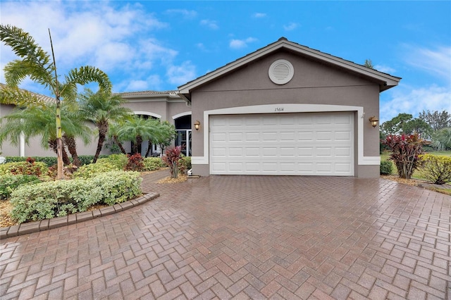 single story home featuring a garage