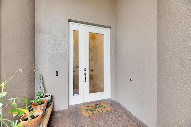 doorway to property featuring french doors