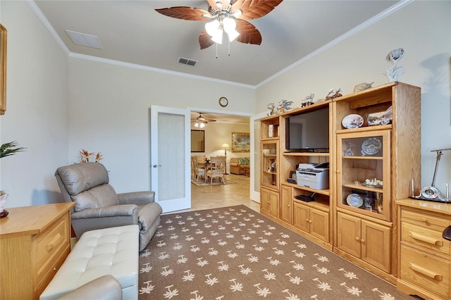 living room with crown molding, ceiling fan, and french doors