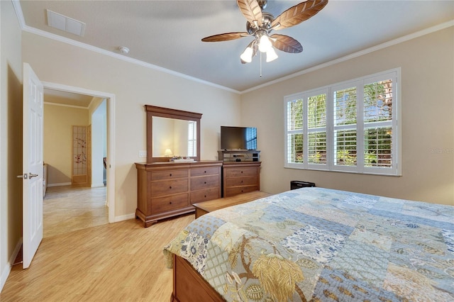 bedroom with crown molding, ceiling fan, and light hardwood / wood-style floors