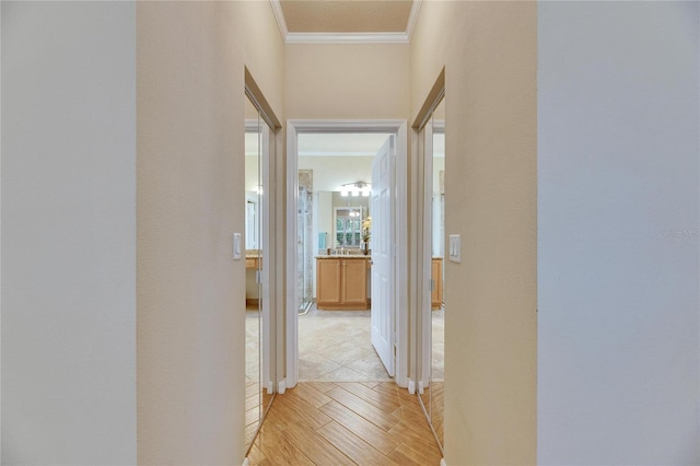 hallway featuring ornamental molding