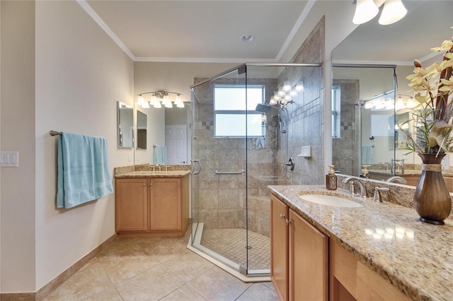 bathroom with tile patterned flooring, vanity, ornamental molding, and walk in shower