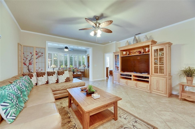 living room with ceiling fan, ornamental molding, and light tile patterned floors