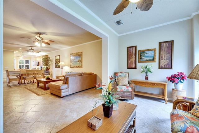 tiled living room with crown molding and ceiling fan