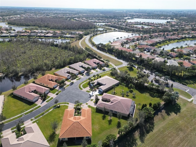 drone / aerial view with a water view