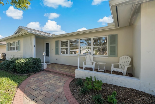 property entrance with a patio area