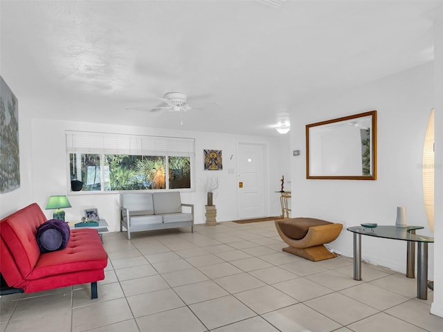 living room featuring light tile patterned flooring and ceiling fan