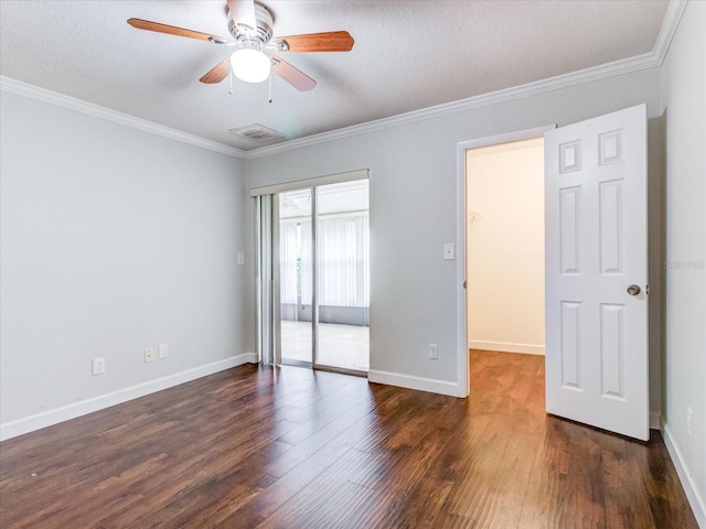 unfurnished bedroom with dark hardwood / wood-style flooring, ornamental molding, a closet, and ceiling fan