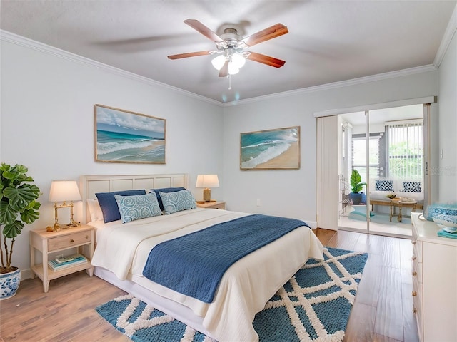 bedroom featuring ornamental molding, ceiling fan, and light hardwood / wood-style flooring