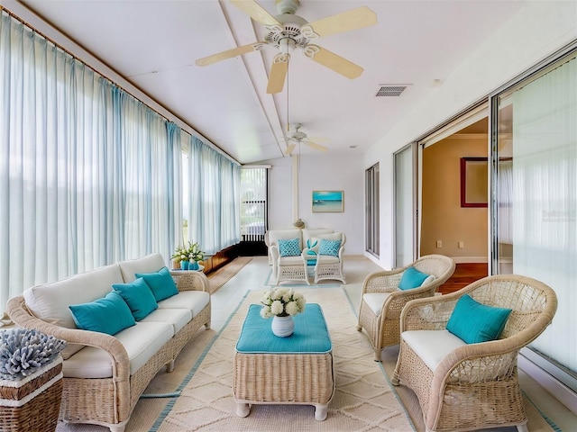 sunroom with ceiling fan