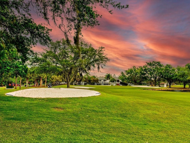 view of home's community with a yard and volleyball court