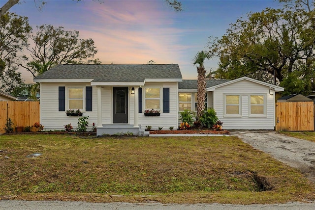 ranch-style house with a lawn