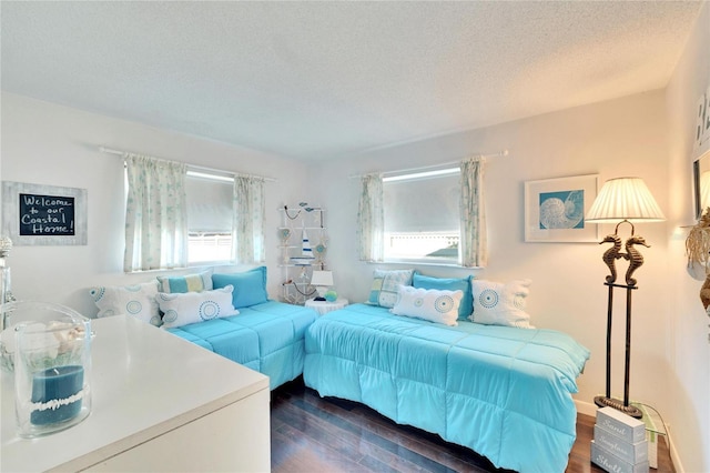 2589 Redwood Cir, Clearwater, FL 33763 - bedroom with dark wood-style flooring and a textured ceiling