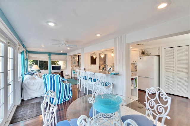 2589 Redwood Cir, Clearwater, FL 33763 - dining space featuring wood finished floors, a ceiling fan, and recessed lighting