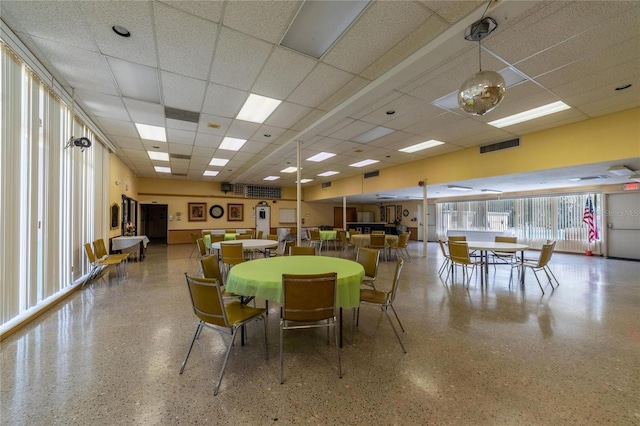 2589 Redwood Cir, Clearwater, FL 33763 - dining area featuring a paneled ceiling and speckled floor