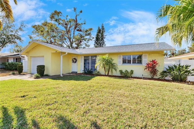 2589 Redwood Cir, Clearwater, FL 33763 - ranch-style home featuring an attached garage, stucco siding, and concrete driveway