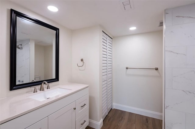 bathroom with wood-type flooring and vanity